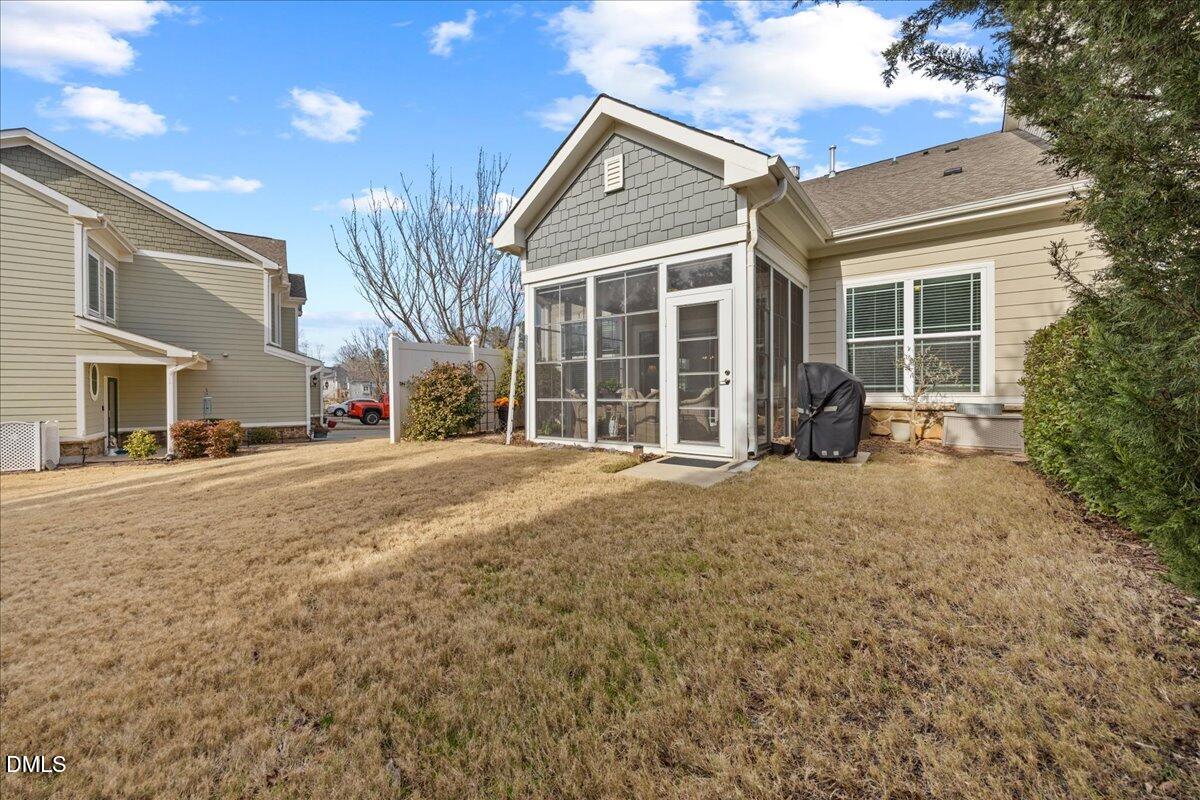 216 Mayfield Drive Apex, NC 27539 - Photo 40 of 66 a view of a house with backyard and sitting area