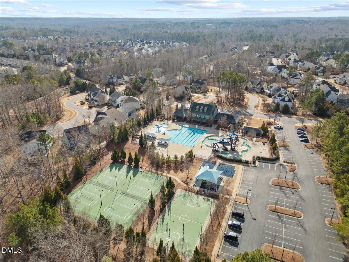 216 Mayfield Drive Apex, NC 27539 - Photo 49 of 66 an aerial view of residential building and parking space