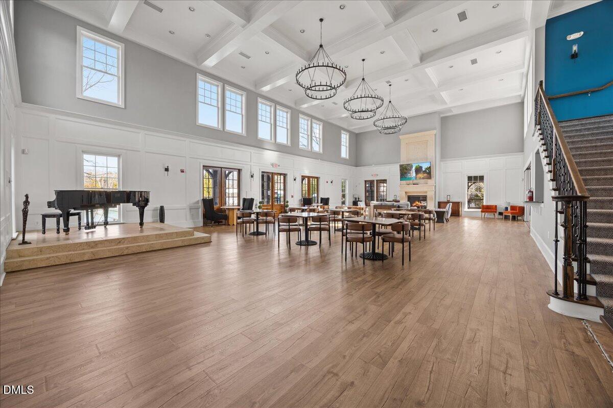 216 Mayfield Drive Apex, NC 27539 - Photo 56 of 66 a view of a room with lots of wooden furniture and a large window