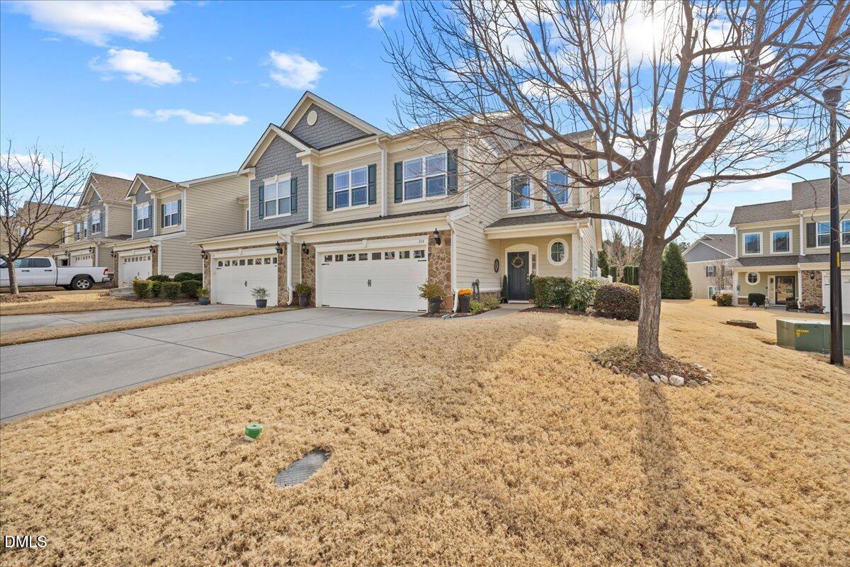 216 Mayfield Drive Apex, NC 27539 - Photo 63 of 66 a front view of a building with large trees