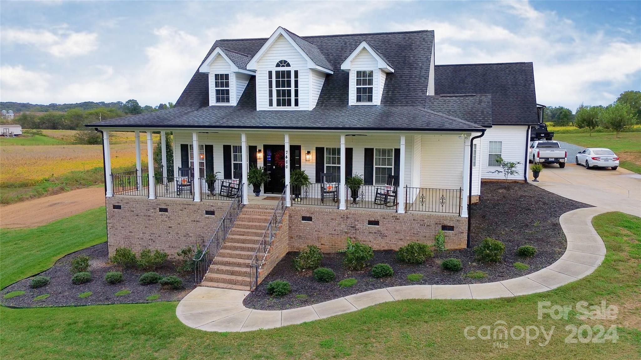 7400 Carl Polk Road Monroe, NC 28110 - Photo 1 of 48 a front view of a house with garden