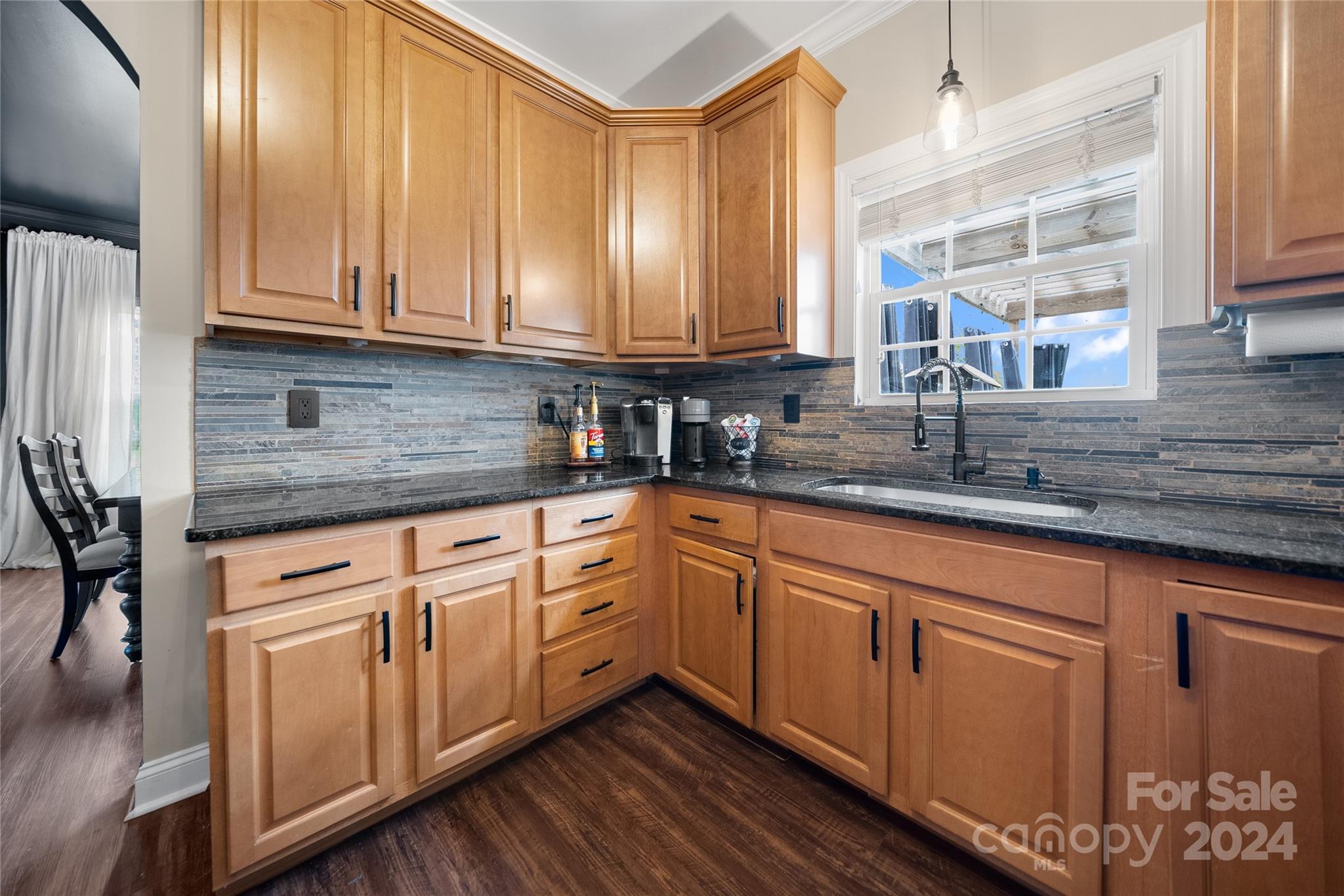 7400 Carl Polk Road Monroe, NC 28110 - Photo 11 of 48 a kitchen with stainless steel appliances granite countertop a sink a stove and cabinets