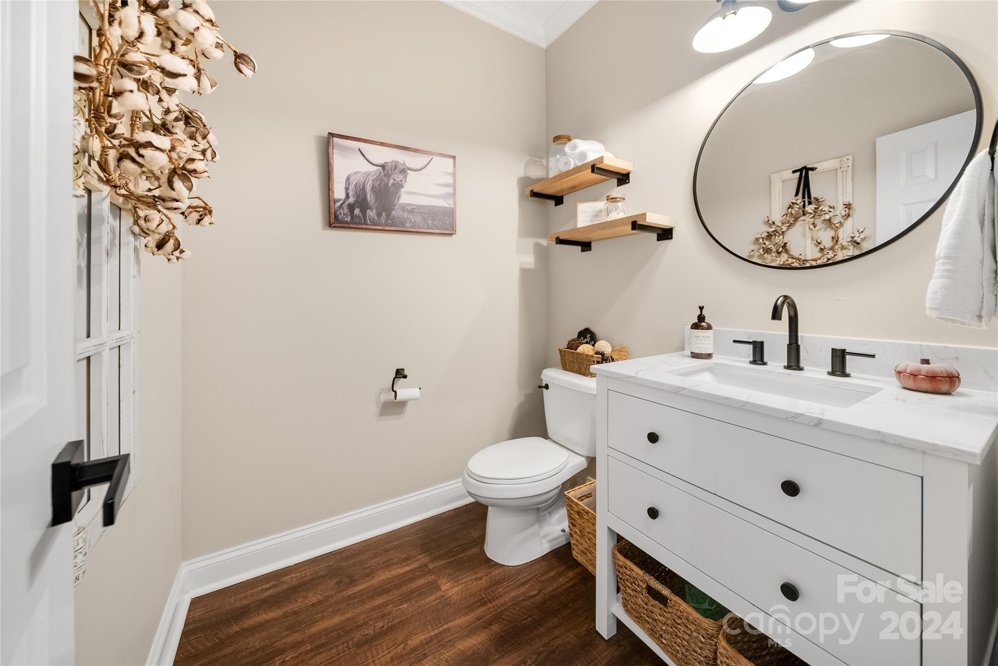 7400 Carl Polk Road Monroe, NC 28110 - Photo 15 of 48 a bathroom with a toilet a sink and a mirror