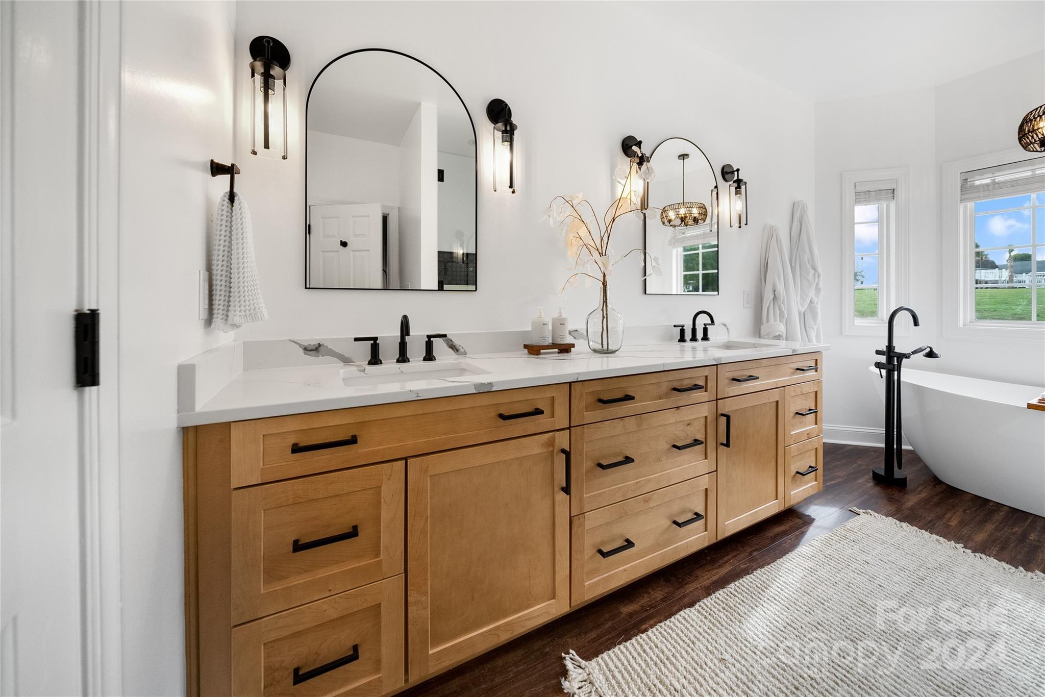 7400 Carl Polk Road Monroe, NC 28110 - Photo 21 of 48 a spacious en suite bathroom with double sink and a mirror