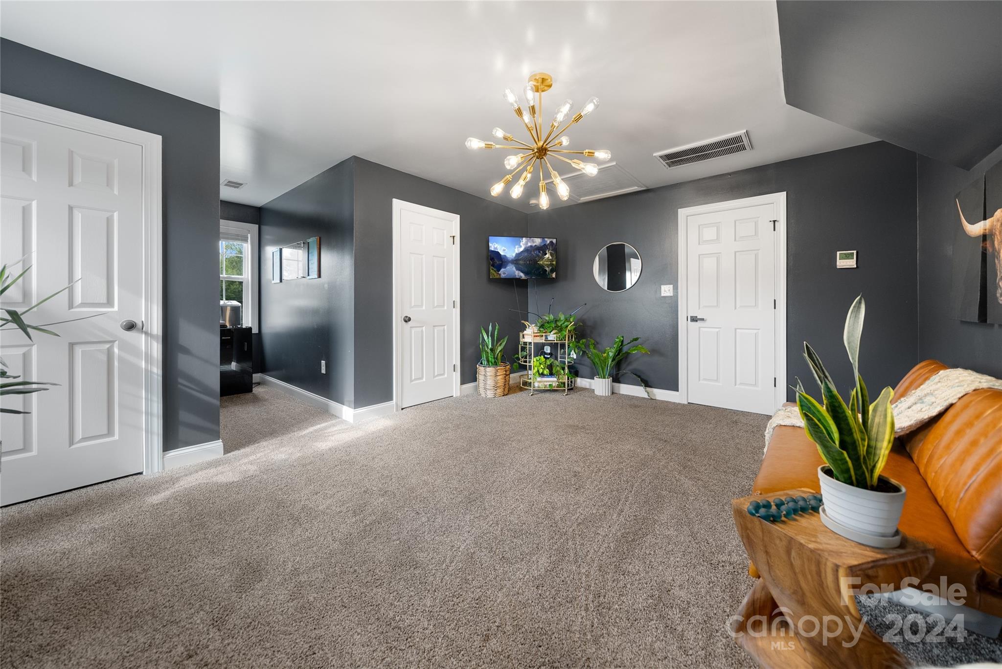 7400 Carl Polk Road Monroe, NC 28110 - Photo 26 of 48 a view of a livingroom with furniture and a chandelier