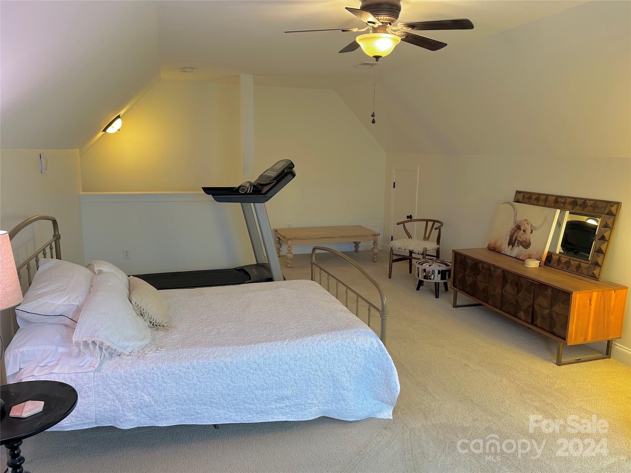 7400 Carl Polk Road Monroe, NC 28110 - Photo 34 of 48 a bedroom with a bed furniture and a chandelier