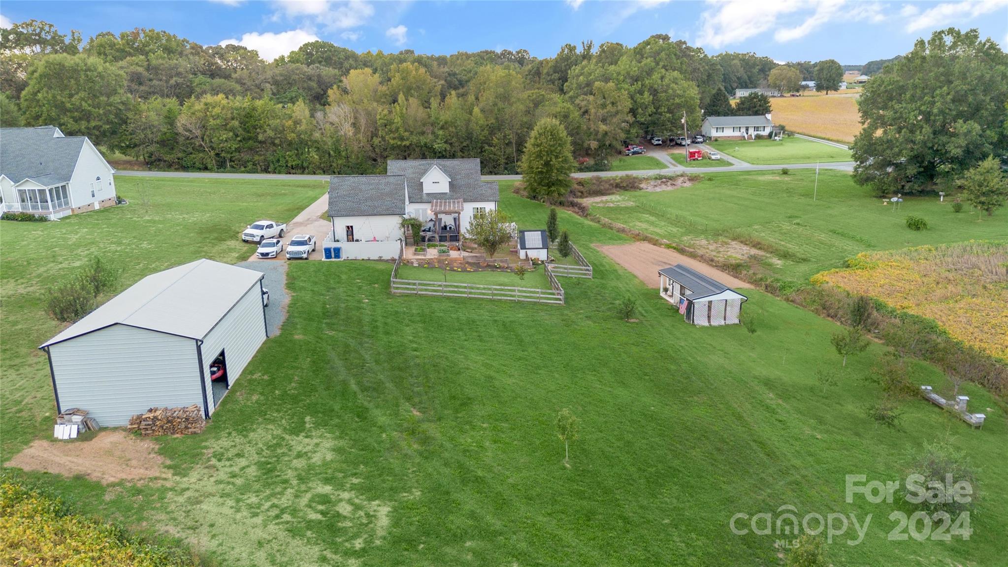 7400 Carl Polk Road Monroe, NC 28110 - Photo 47 of 48 a view of a garden with a building in the background