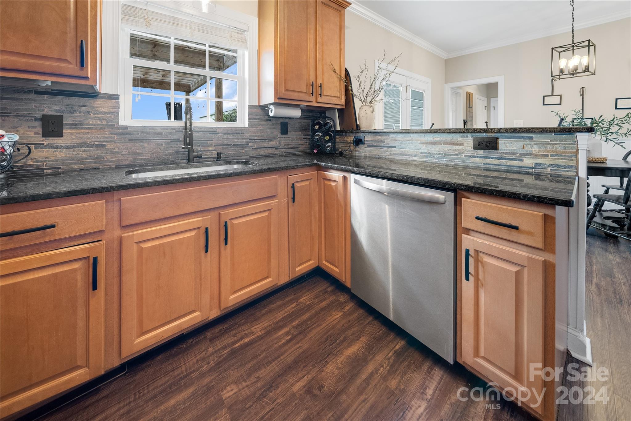 7400 Carl Polk Road Monroe, NC 28110 - Photo 10 of 48 a kitchen with stainless steel appliances granite countertop a sink and dishwasher with wooden floor