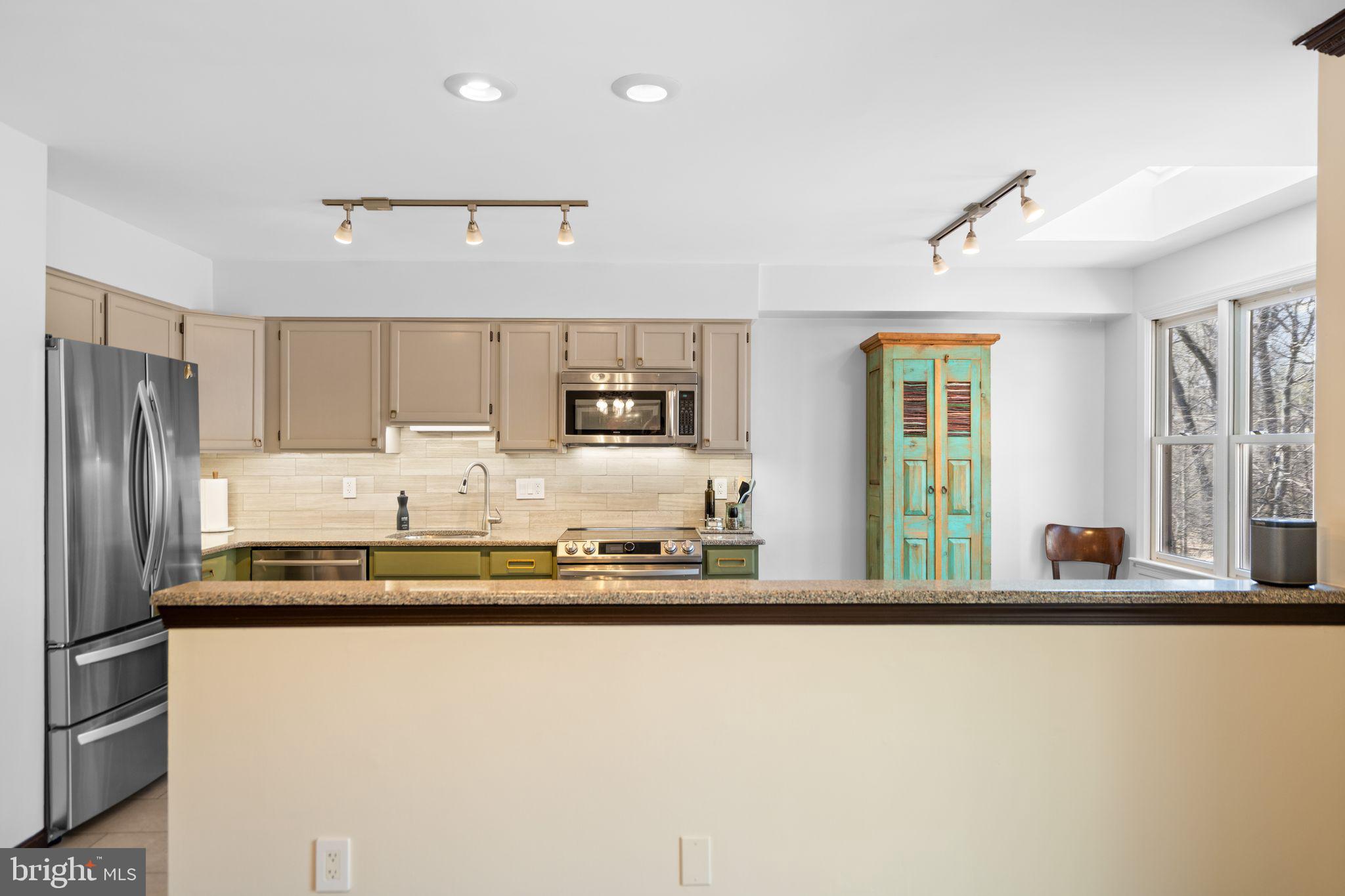 9012 Daum Court Springfield, VA 22153 - Photo 33 of 46 Modern kitchen with vibrant accents.