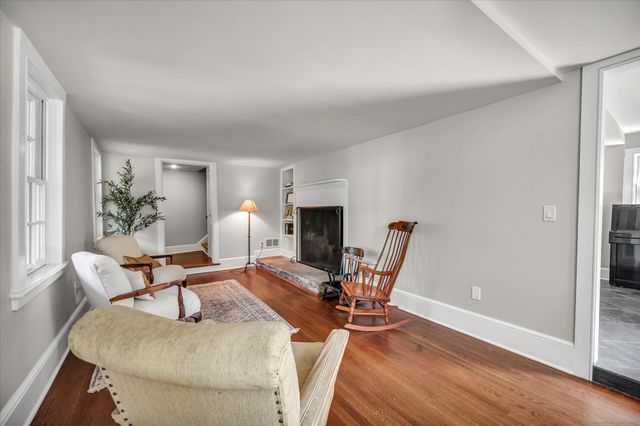 a living room with furniture a table and chairs