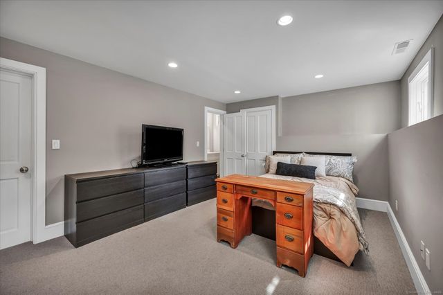 a room with a bed and a television in it