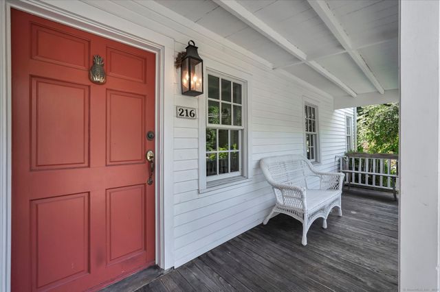 a view of a livingroom with furniture window and wooden floor
