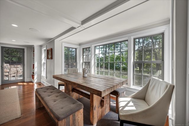 a view of a dining room with furniture window and outside view