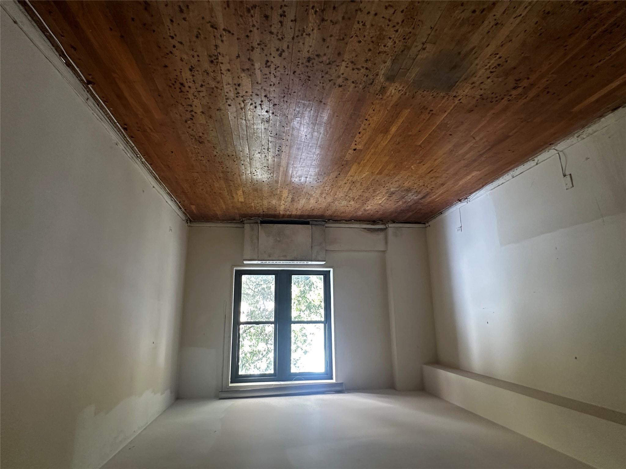 18-75 Corporal Kennedy Street, Unit 4A Queens, NY 11360 - Photo 13 of 25 Spare room featuring radiator heating unit and wood-type flooring