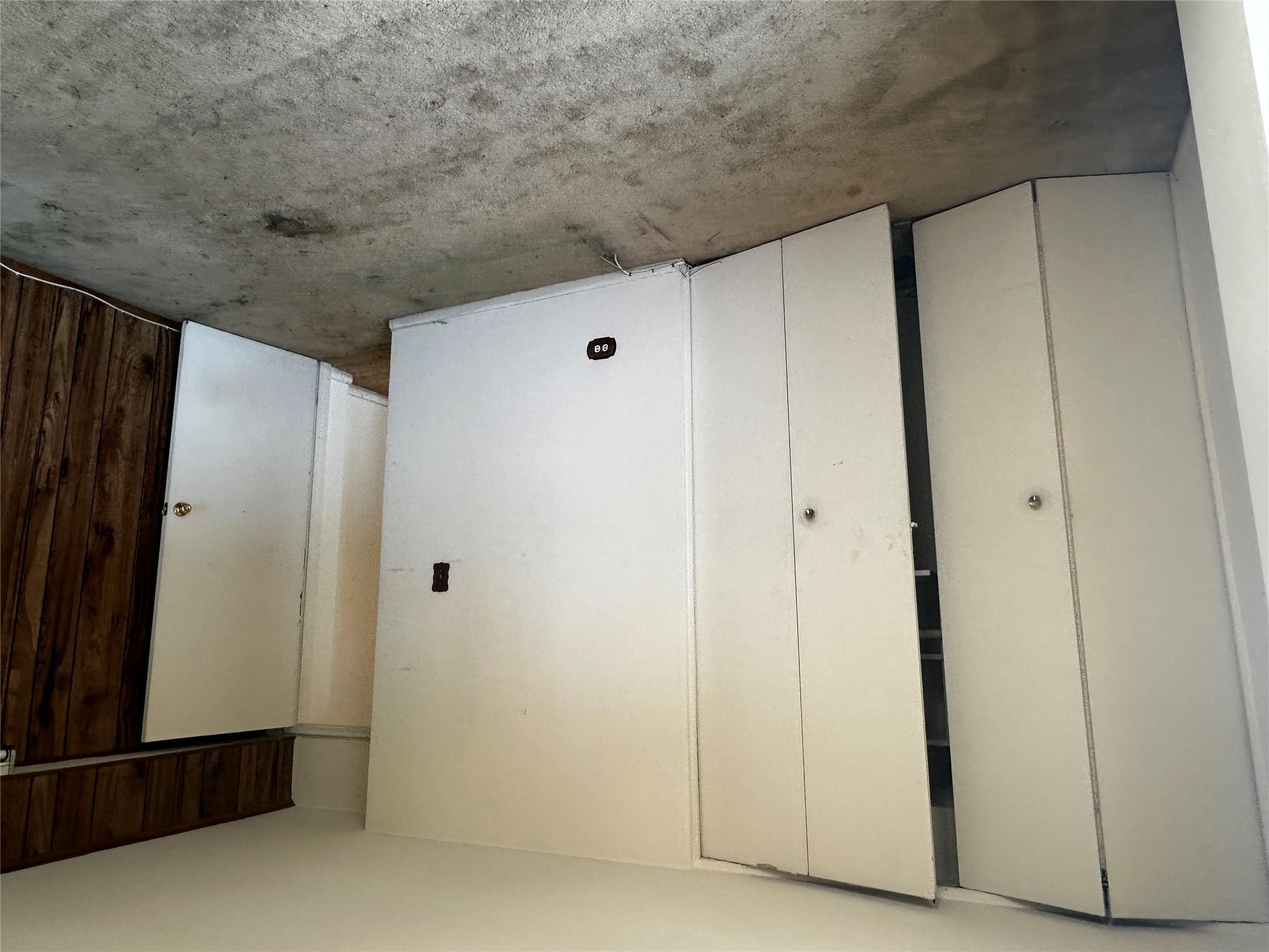 18-75 Corporal Kennedy Street, Unit 4A Queens, NY 11360 - Photo 19 of 25 Unfurnished bedroom with light carpet