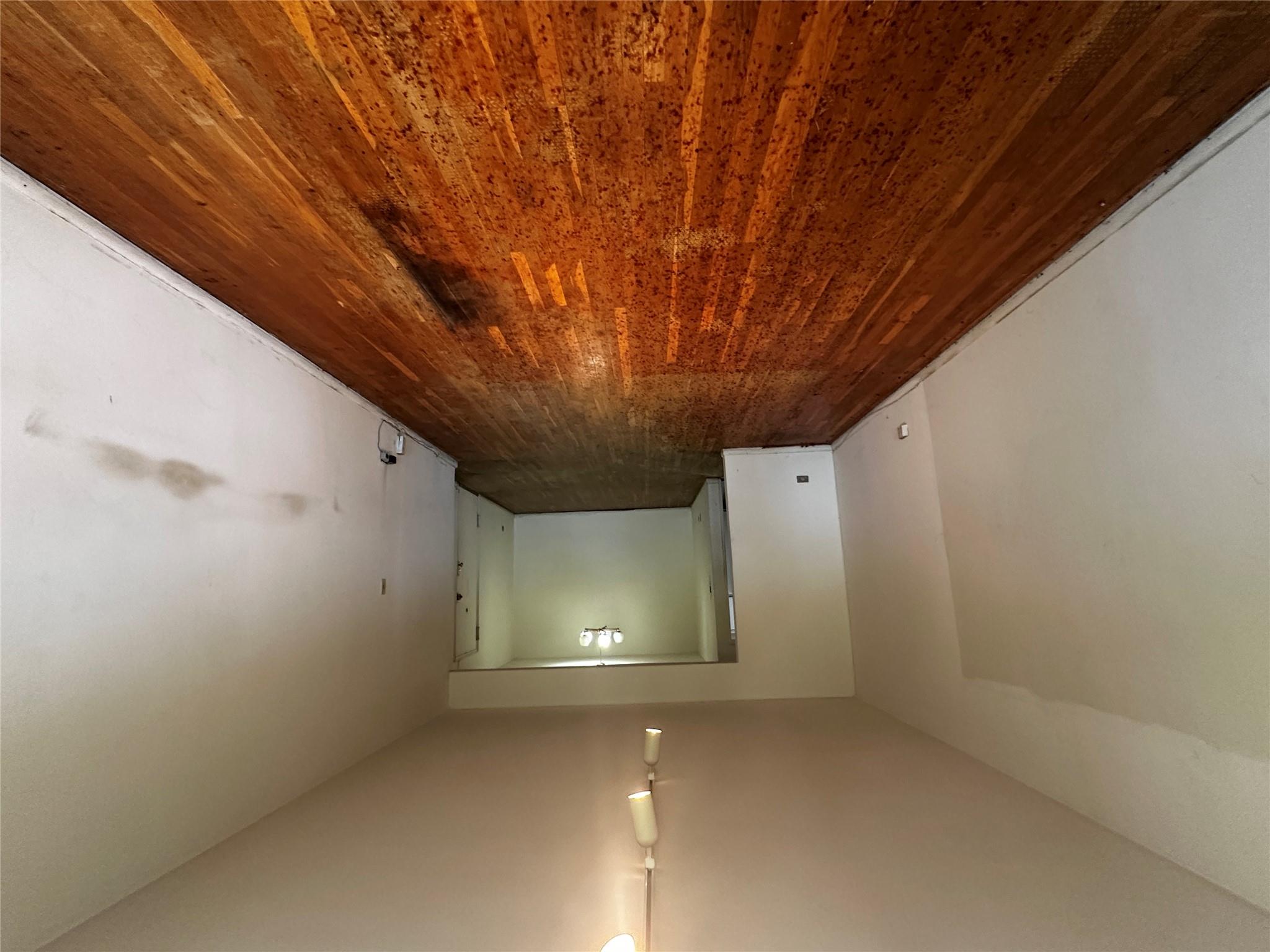 18-75 Corporal Kennedy Street, Unit 4A Queens, NY 11360 - Photo 6 of 25 Unfurnished room with wood finished floors and rail lighting