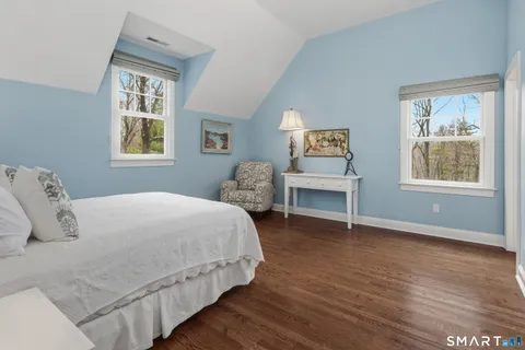 a bathroom with a sink a toilet and shower curtain