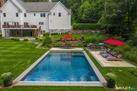 a view of a backyard with sitting area