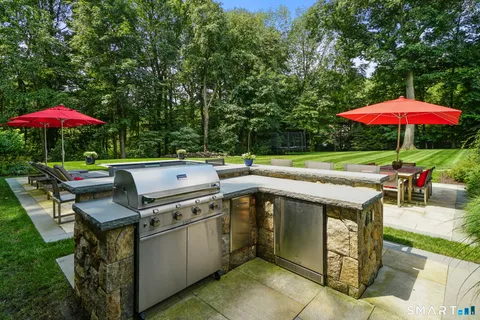 an outdoor space with furniture and umbrella