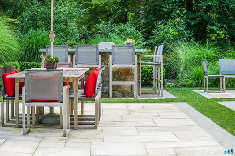a view of a table and chairs under an umbrella