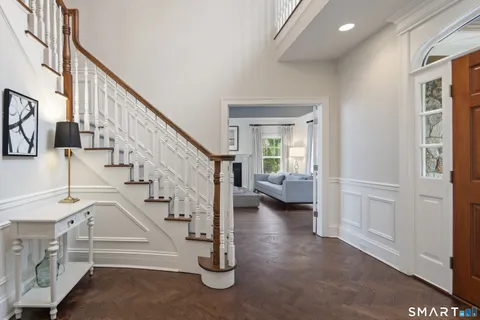 a view of entryway and hall with a living room