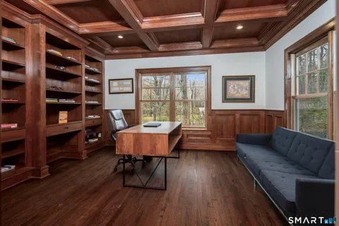 a view of a livingroom with furniture and a potted plant