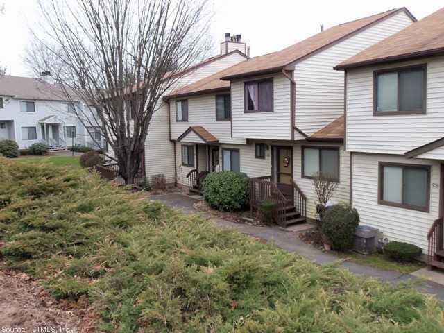 524 Cypress Road, Unit 524 Newington, CT 06111 - Photo 1 of 1 a view of a yard in front of a brick house with large windows