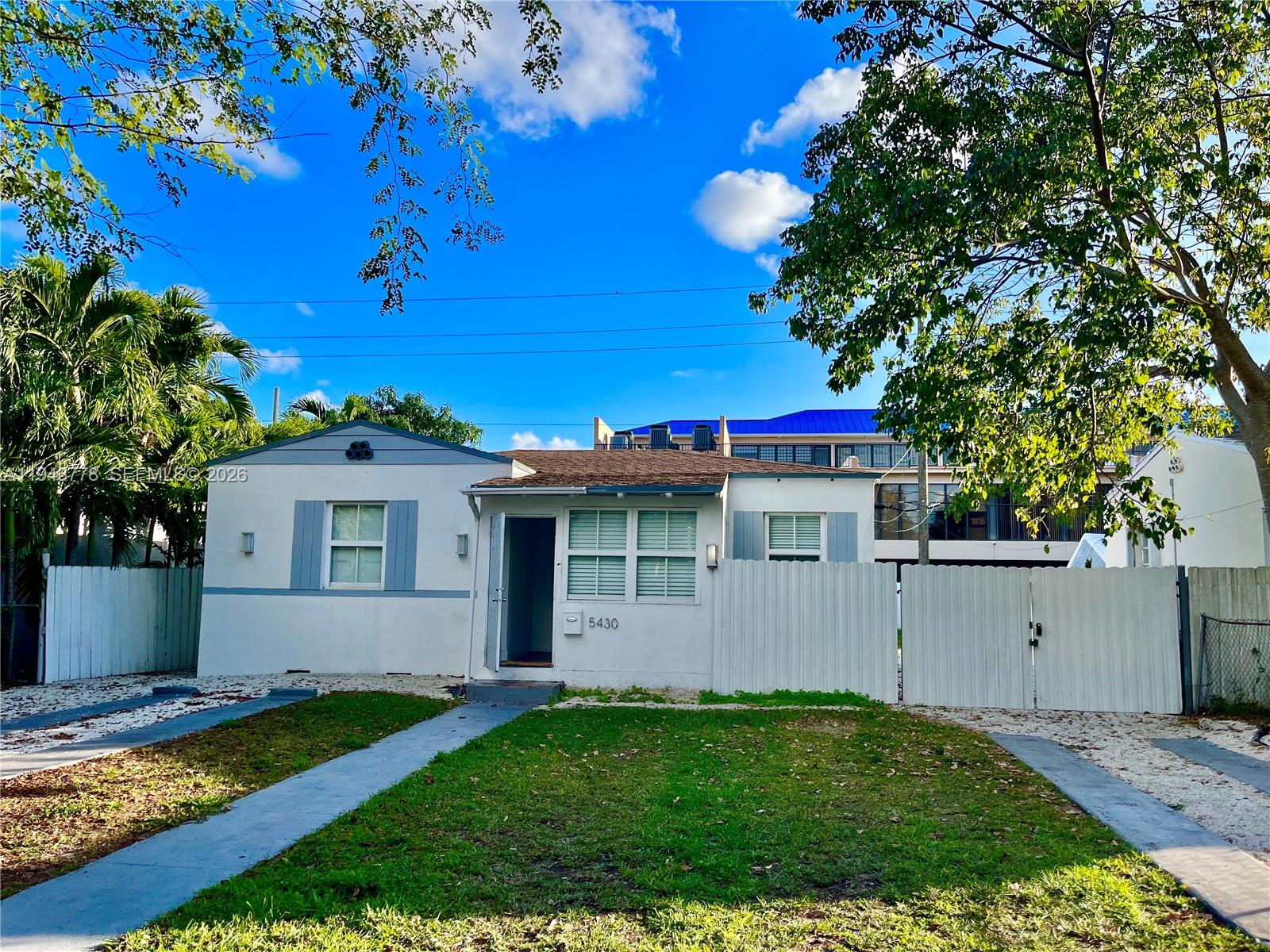 a view of a house with a yard