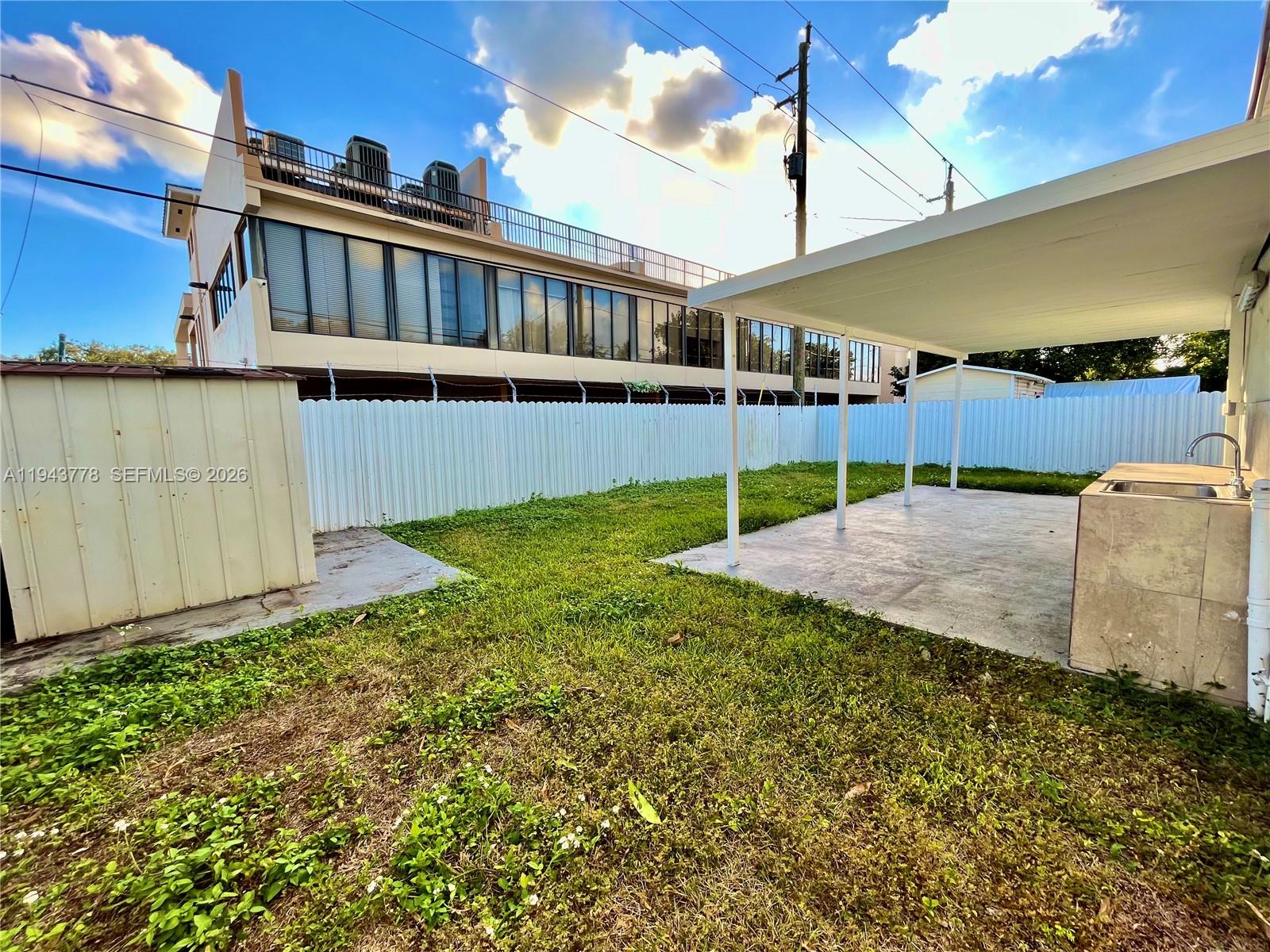 5430 Southwest 7th Street Miami, FL 33134 - Photo 12 of 16 a view of a house with backyard and sitting area
