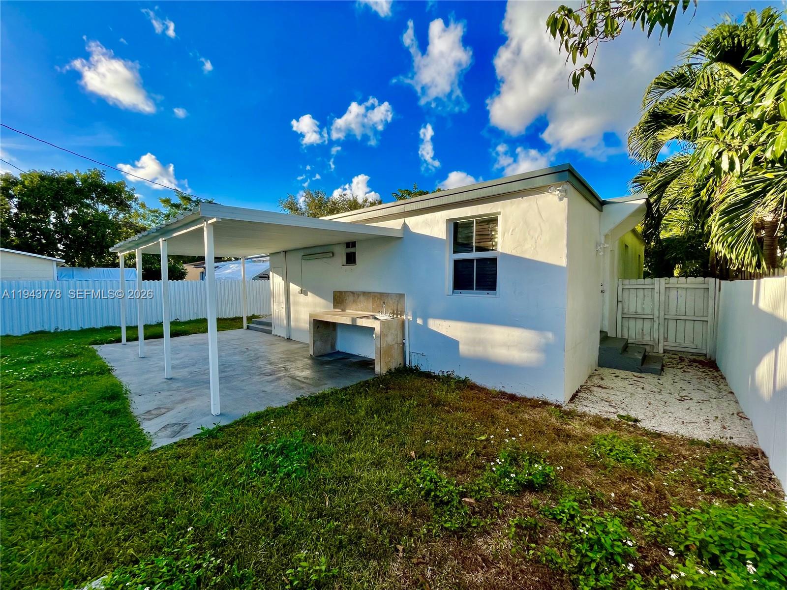 5430 Southwest 7th Street Miami, FL 33134 - Photo 14 of 16 a view of a house with a patio