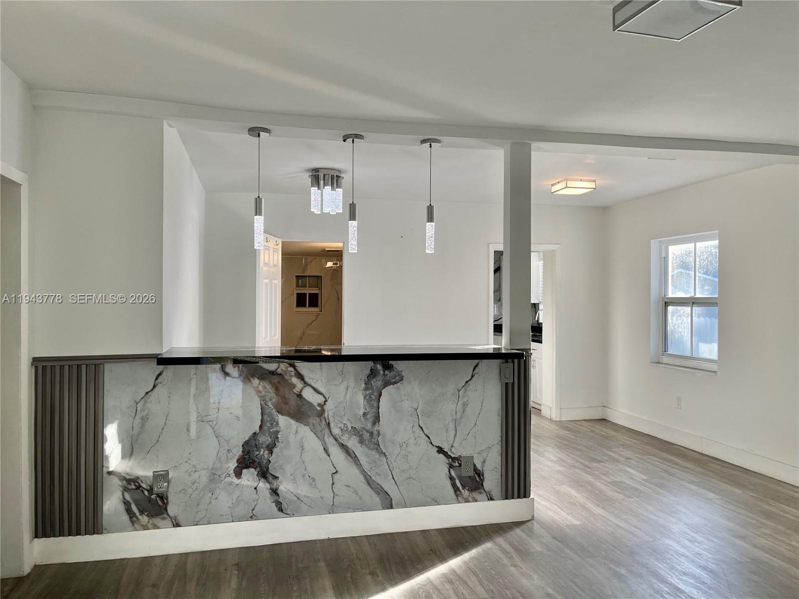 5430 Southwest 7th Street Miami, FL 33134 - Photo 3 of 16 a view of a livingroom with wooden floor