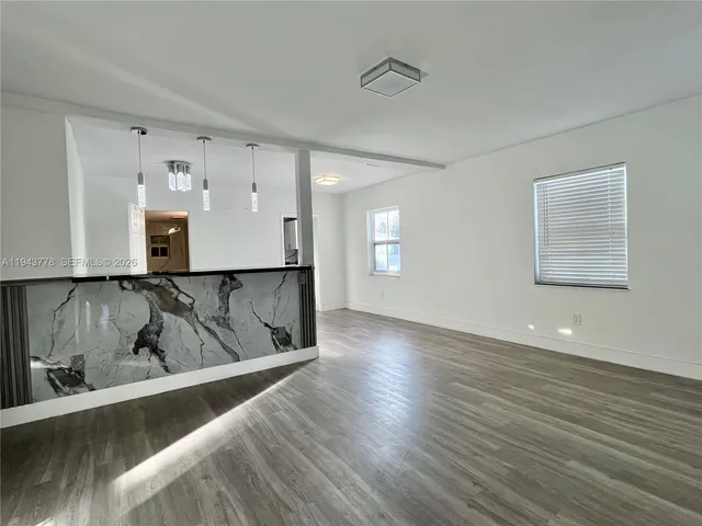 a view of kitchen and wooden floor