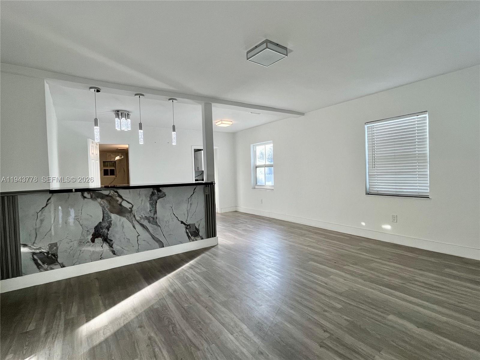5430 Southwest 7th Street Miami, FL 33134 - Photo 4 of 16 a view of kitchen and wooden floor