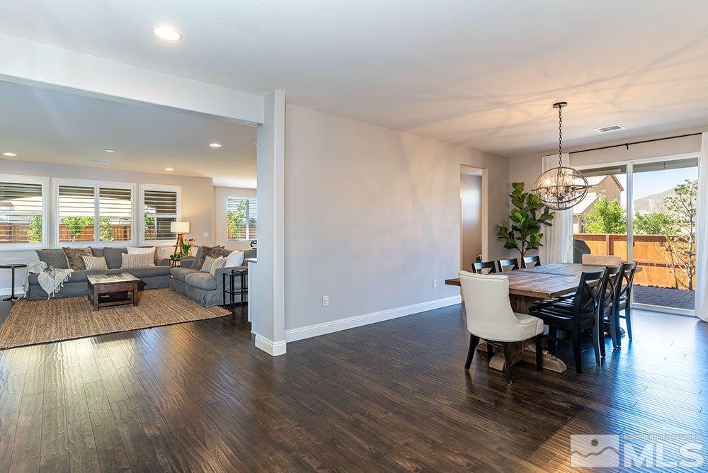 9825 Copenhagen Way Reno, NV 89521 - Photo 3 of 35 a dining room with furniture window and wooden floor