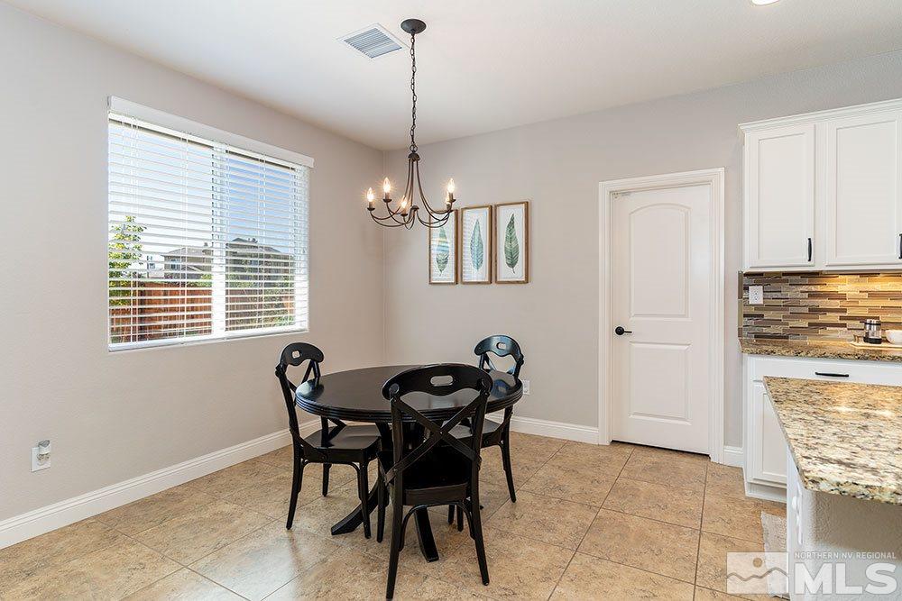 9825 Copenhagen Way Reno, NV 89521 - Photo 10 of 35 a dining room with furniture and window
