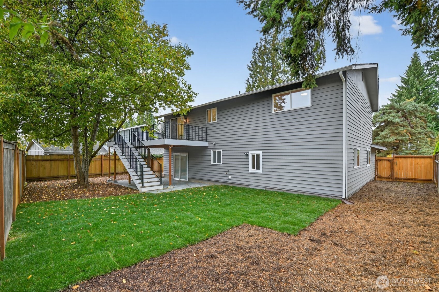 17203 Brook Boulevard Bothell, WA 98012 - Photo 28 of 31 a view of a house with a yard and a large tree