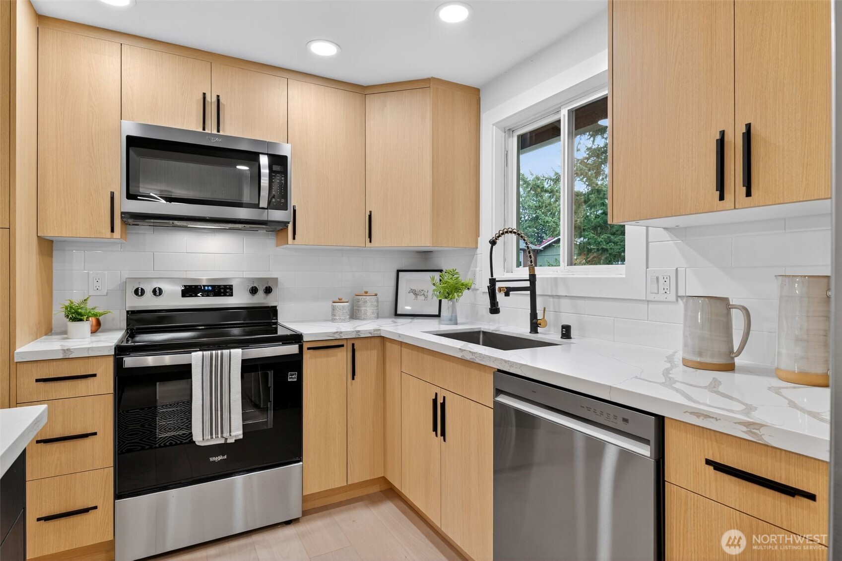 17203 Brook Boulevard Bothell, WA 98012 - Photo 7 of 31 a kitchen with stainless steel appliances granite countertop a sink stove and microwave