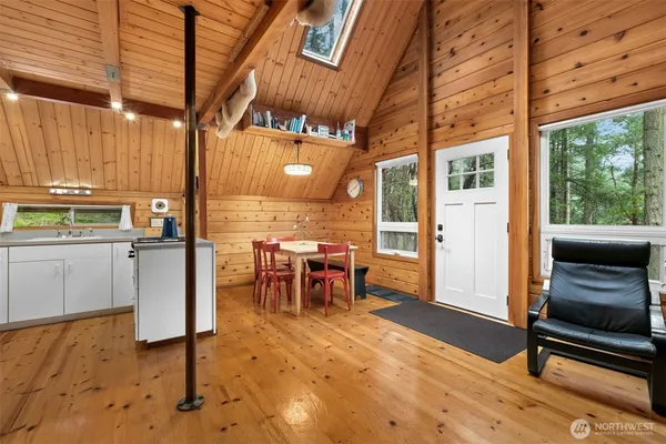 a view of a kitchen with furniture and a window