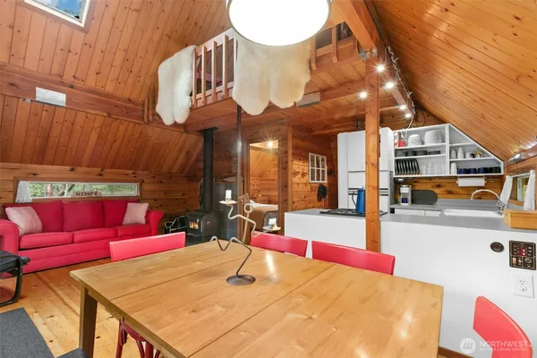 a view of a patio with swimming pool and sitting area
