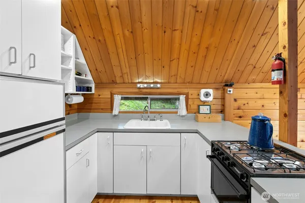a kitchen with stainless steel appliances a stove and a refrigerator