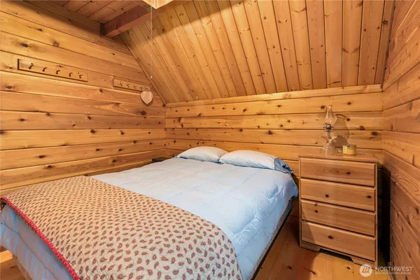 a bedroom with a bed and a space