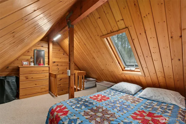 a bedroom with a bed and a closet