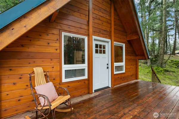 a view of a two chairs in the patio