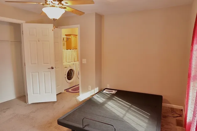 a room with a bed and window