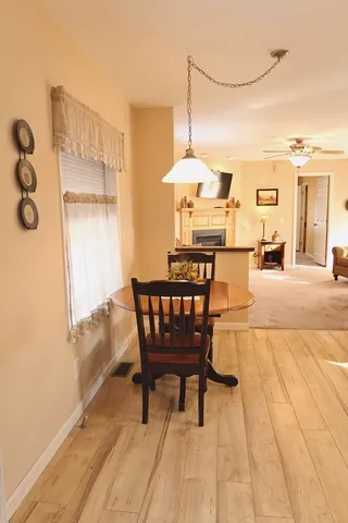 a dining room with furniture and window