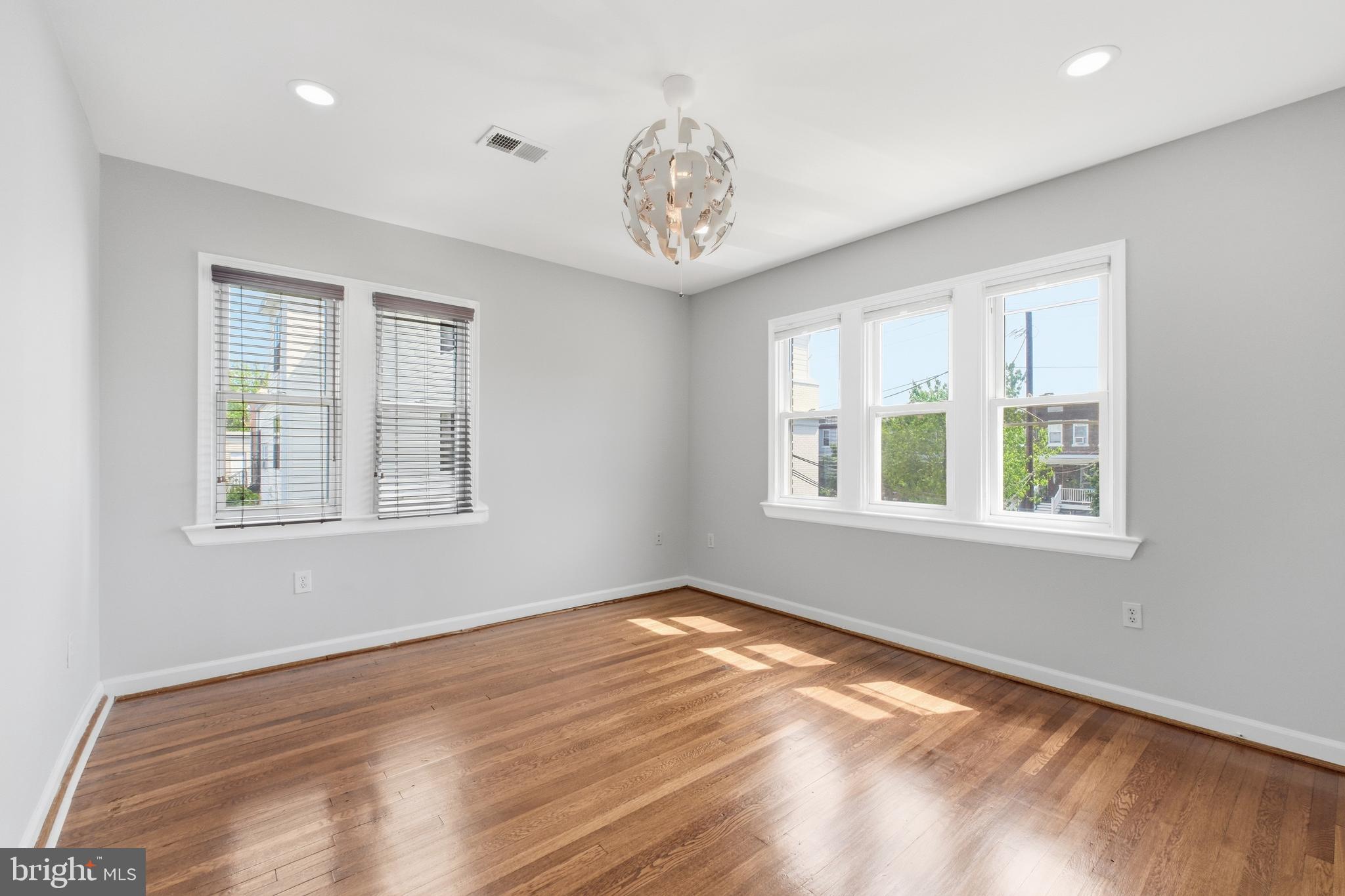 2712 6th Street Northeast Washington, DC 20017 - Photo 14 of 24 a view of an empty room with window and wooden floor