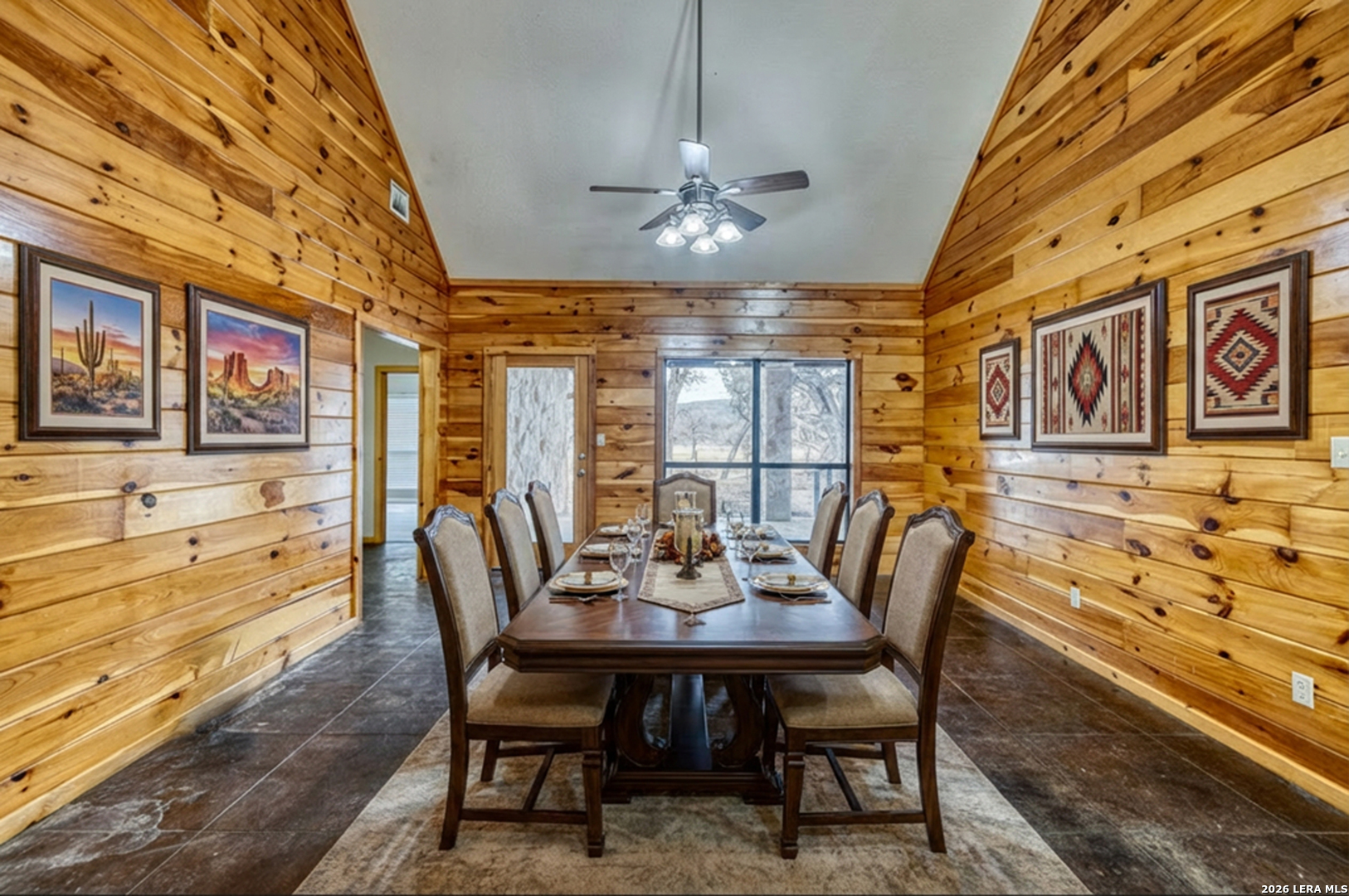 498 Camino Del Rancho Concan, TX 78838 - Photo 16 of 49 a view of a dining room with furniture window and wooden floor