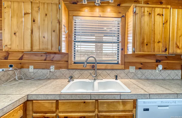 a bathroom with a sink and a granite countertop