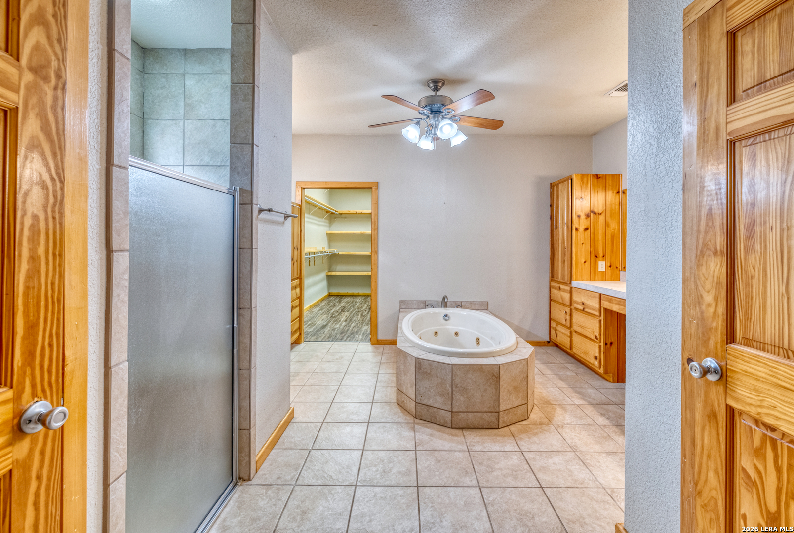498 Camino Del Rancho Concan, TX 78838 - Photo 21 of 49 a bathroom with a toilet sink and mirror