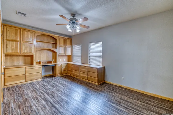 a bedroom with furniture and windows